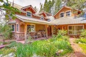 a home in the woods with a patio at Steps From Natl Forest Creekside Home in Durango in Durango