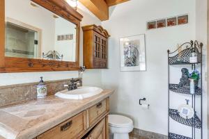 a bathroom with a sink and a toilet at Steps From Natl Forest Creekside Home in Durango in Durango +33 photos