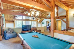 a pool table in a living room with wooden ceilings at Steps From Natl Forest Creekside Home in Durango in Durango