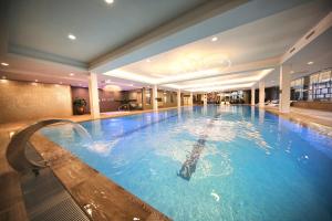 a large swimming pool in a hotel room at Van der Valk Hotel Akersloot / A9 ALKMAAR in Akersloot
