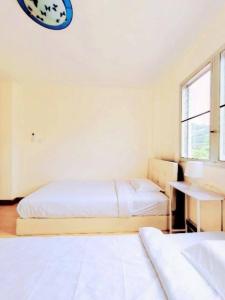 Postel nebo postele na pokoji v ubytování 127 House
