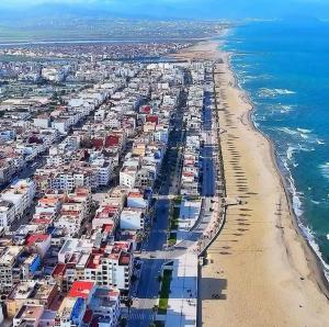 an aerial view of a beach and the ocean at Beautiful, well-equipped apartment in Martil