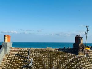 a view of the ocean from the roof of a building at Penthouse Suite, Sea View, Close to Shops, Beach and Train in St. Leonards