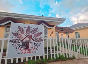 a sign on a fence in front of a house at Dahilayan Bukidnon Shyhouse in Manolo Fortich