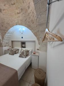 Ένα ή περισσότερα κρεβάτια σε δωμάτιο στο I tre trulli