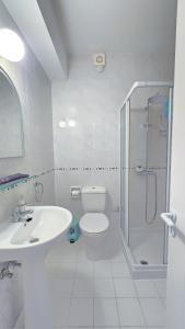 a bathroom with a shower and a toilet and a sink at CSS Cosmic Smart Superior Sea View Tala in Tala
