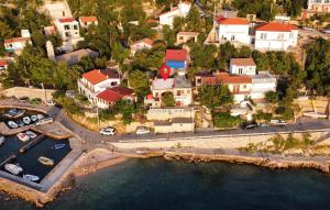 an aerial view of a small town next to the water at Stunning Apartment In Senj With Kitchen in Starigrad +20 photos
