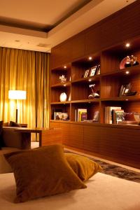 a living room with a couch and a desk in a room at Candeo Hotels Ueno Park in Tokyo