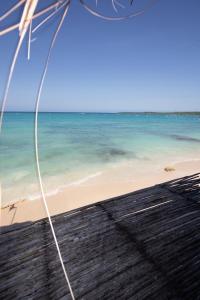 a view of a beach with the ocean at CARDUMEN Arte y Cocina in Playa Blanca +5 photos