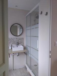 a bathroom with a sink and a mirror at Chambre discrète 2 à 3 pers in Camphin-en-Carembault