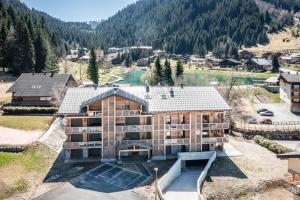 an aerial view of a large house in the mountains at Apartment Yuki Châtel - by EMERALD STAY in Châtel