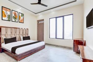 Postel nebo postele na pokoji v ubytování Super Hotel O BAL GOPAL