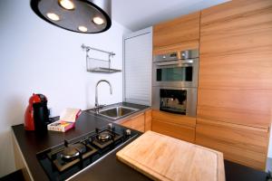 a kitchen with a sink and a stove top oven at Luxury apartment in Las Palmas de Gran Canaria