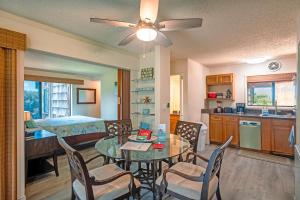a kitchen and dining room with a table and chairs at Sealodge B4 in Princeville