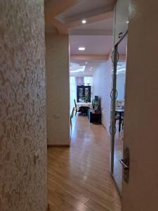 an open door to a hallway with a dining room at სასიამოვნო ბინა საბურთალოზე in Tbilisi City