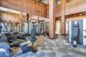 a fitness room with treadmills and cardio machines at Boulevard Stays Dashing 1BR Suite Pool Parking Gym H in Richardson
