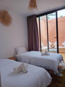 Ένα ή περισσότερα κρεβάτια σε δωμάτιο στο Appartement Madeleine Uniquement les familles