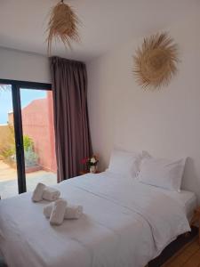 Ένα ή περισσότερα κρεβάτια σε δωμάτιο στο Appartement Madeleine Uniquement les familles +32 φωτογραφίες