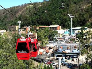 a group of people riding on a ski lift at Riverside Escape in Greystone Heights