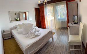 Postel nebo postele na pokoji v ubytování Vila Thomas