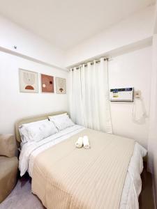Postel nebo postele na pokoji v ubytování Near Mactan Airpor Hideout Condo