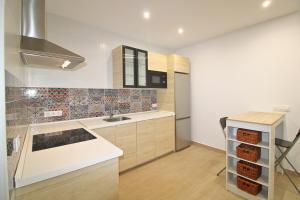 a kitchen with a sink and a counter top at Gran Vía 22 by SIERRA VIVA in Aracena +3 photos