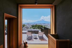 a balcony with a view of a mountain in the distance at edit x seven FUJI GOTEMBA in Gotemba