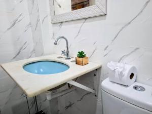 a bathroom with a sink and a toilet at Copacabana Way - 4 Hóspedes, Praia e Privativo in Rio de Janeiro +55 photos