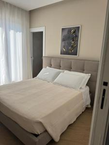 Giường trong phòng chung tại CIVICO 51 Luxury Apartment