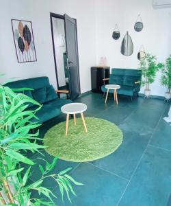 a living room with a couch and a table at Sunshine Bungalow in Schitul +30 photos