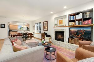 a living room with a couch and a fireplace at Rigden Retreat Garage, Dog Friendly, Near Trails in Fort Collins