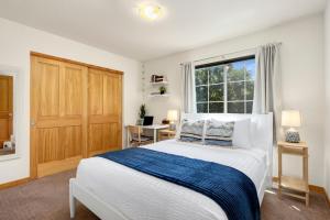 a bedroom with a large bed and a window at Rigden Retreat Garage, Dog Friendly, Near Trails in Fort Collins