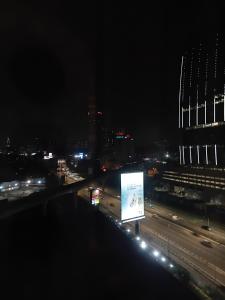 a view of a city at night at Politeknik metro kl in Kuala Lumpur