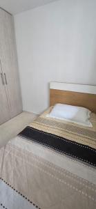 a bed in a small room with a mattress at Apartamento Plazuela Portal Del Prado in Barranquilla