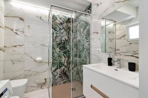 a bathroom with a shower and a toilet and a sink at Balcone Caboto in Torre Lapillo +53 photos