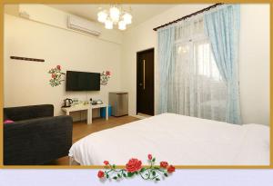 TV a/nebo společenská místnost v ubytování Rose Cottage B&B