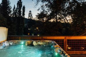a jacuzzi tub on a patio with a view at The Refugio #2552 in Big Bear Lake