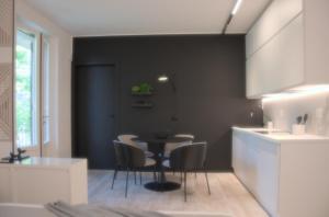 a kitchen with a table and chairs in a room at GardaEssence in Peschiera del Garda