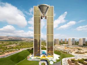 a view of a building with a tower at Intempo Golden Magic Sky Resort & Spa in Benidorm
