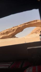 a view of the desert from a window of a vehicle at Wadi rum shadi camp in Wadi Rum