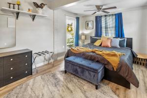 a bedroom with a bed and a dresser and a television at Pet Friendly Near Anna Maria And Img in Bradenton