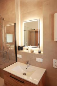 a bathroom with a sink and a mirror at Landhausidylle in Sankt Gilgen