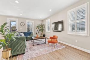 a living room with a couch and a table at Brand New Spacious Luxury Home in Annapolis