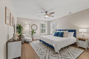 a bedroom with a bed and a ceiling fan at Brand New Spacious Luxury Home in Annapolis