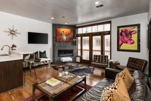 a living room with a couch and a table at LIFT LODGE 102 condo in Park City
