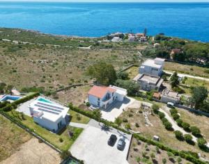 an aerial view of a house and the ocean at Villa Plemmirio Sea View and pool in Plemmirio