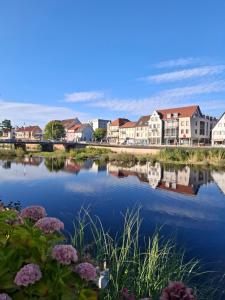 a view of a town with houses and a river at Auszeit Wunschblick in Weisenbach