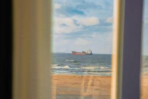 a large boat in the ocean on the beach at الف ليله و ليله اكوا بارك بورسعيد in Port Said