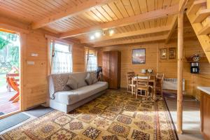 Posezení v ubytování Domki Letniskowe Neptun + 20 fotografií