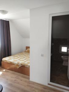 Ένα ή περισσότερα κρεβάτια σε δωμάτιο στο Casa Scurtu 2025 +2 φωτογραφίες